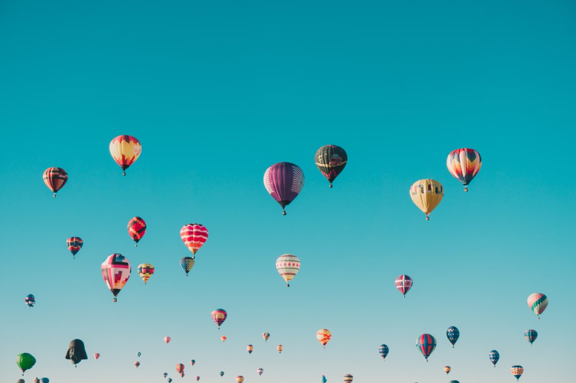 colorful hot air balloons in a clear blue sky
